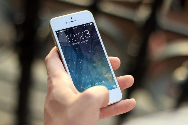 A person holding an iPhone with a starry lock screen display, representing the ongoing legal debates regarding police access to cellphone location data.