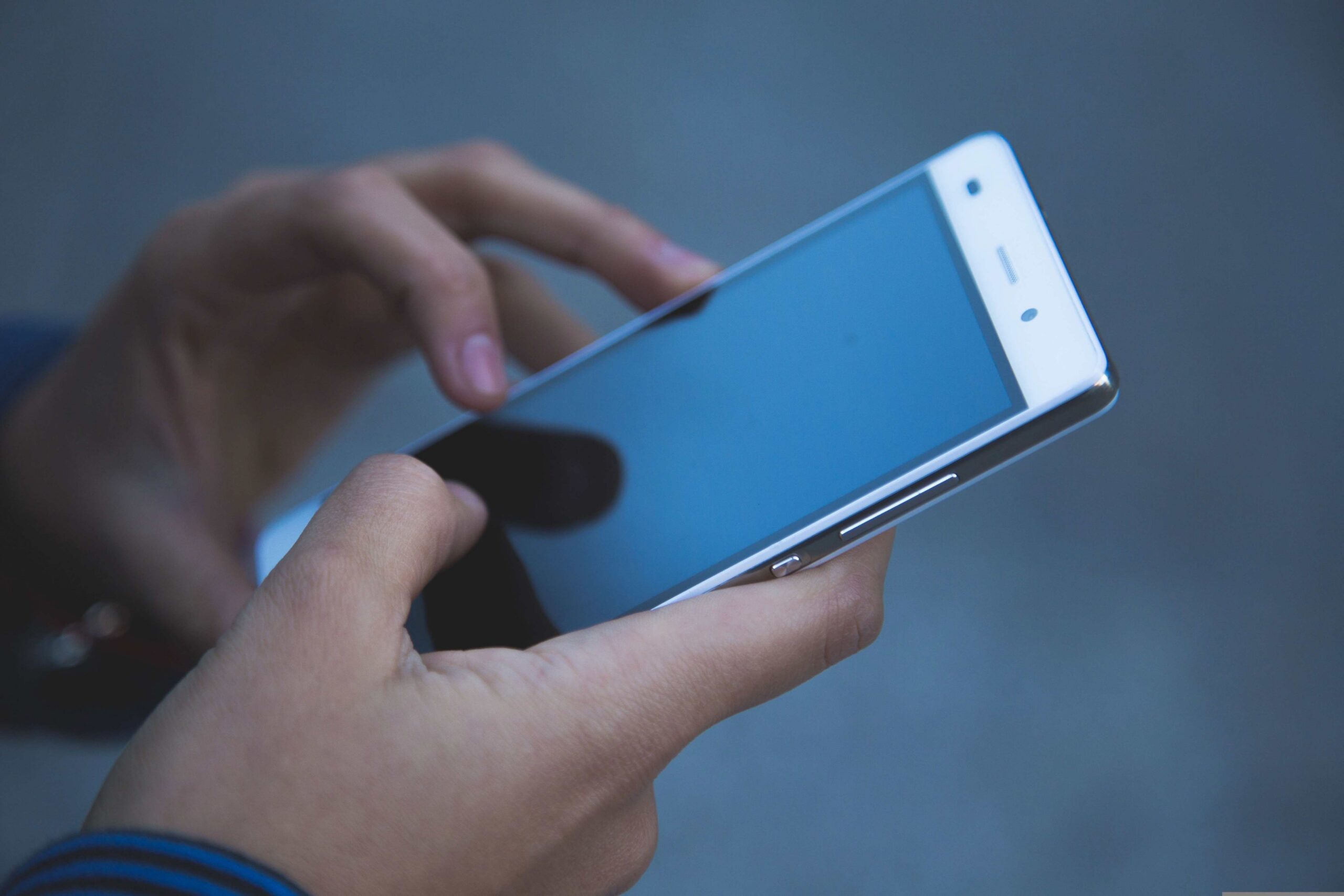 Hands holding smartphone