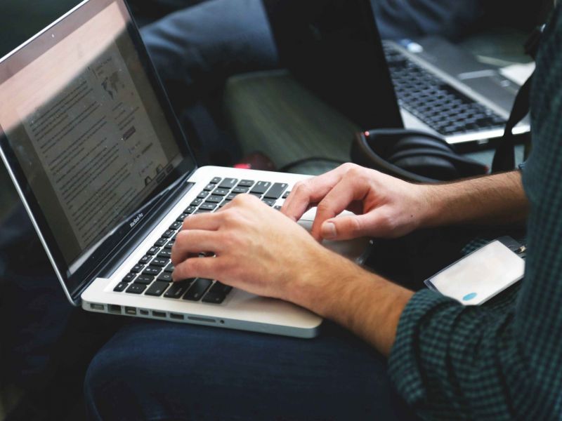 Remote worker typing on laptop